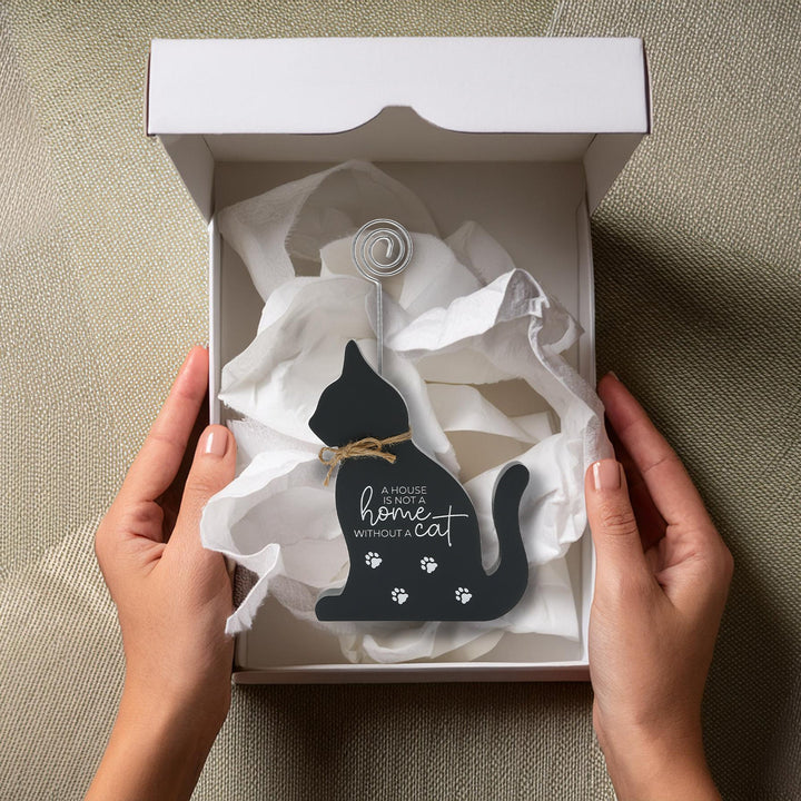 Black cat-shaped plaque with wire photo clip and paw prints in gift box
