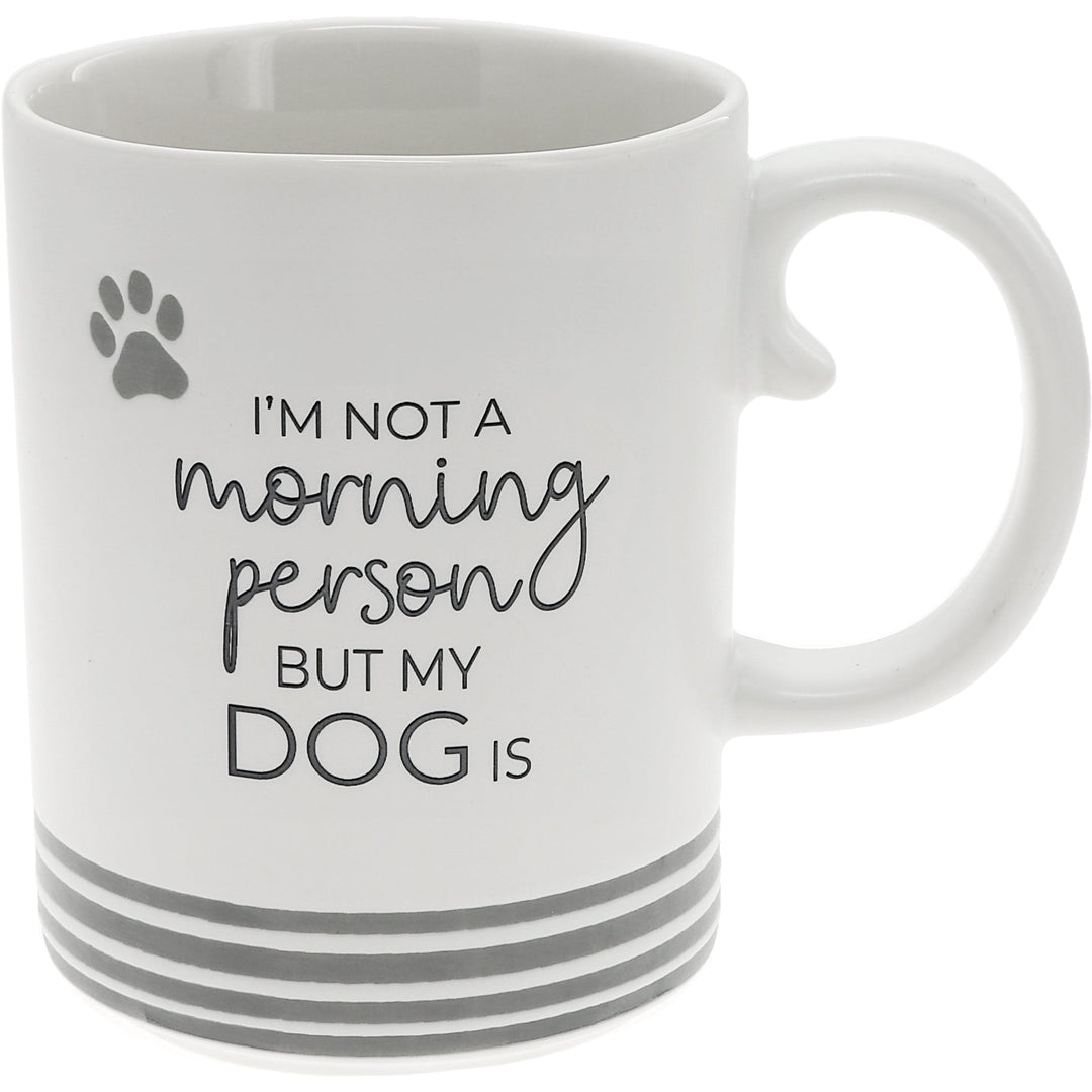 White 15oz mug with gray paw print and text 'I'm not a morning person but my dog is'