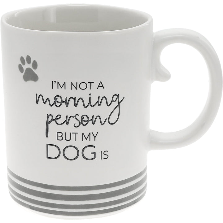 White 15oz mug with gray paw print and text 'I'm not a morning person but my dog is'