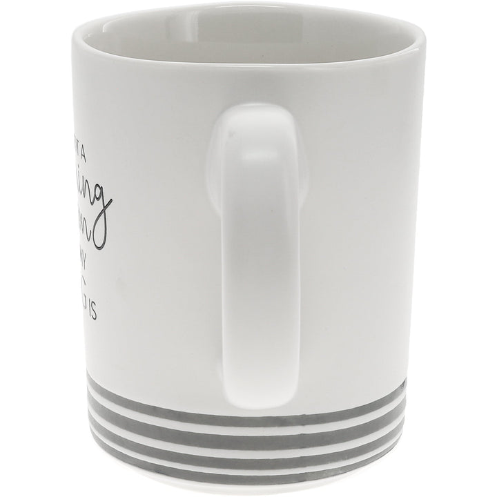 White ceramic mug with gray striped base and dog silhouette design by Pavilion