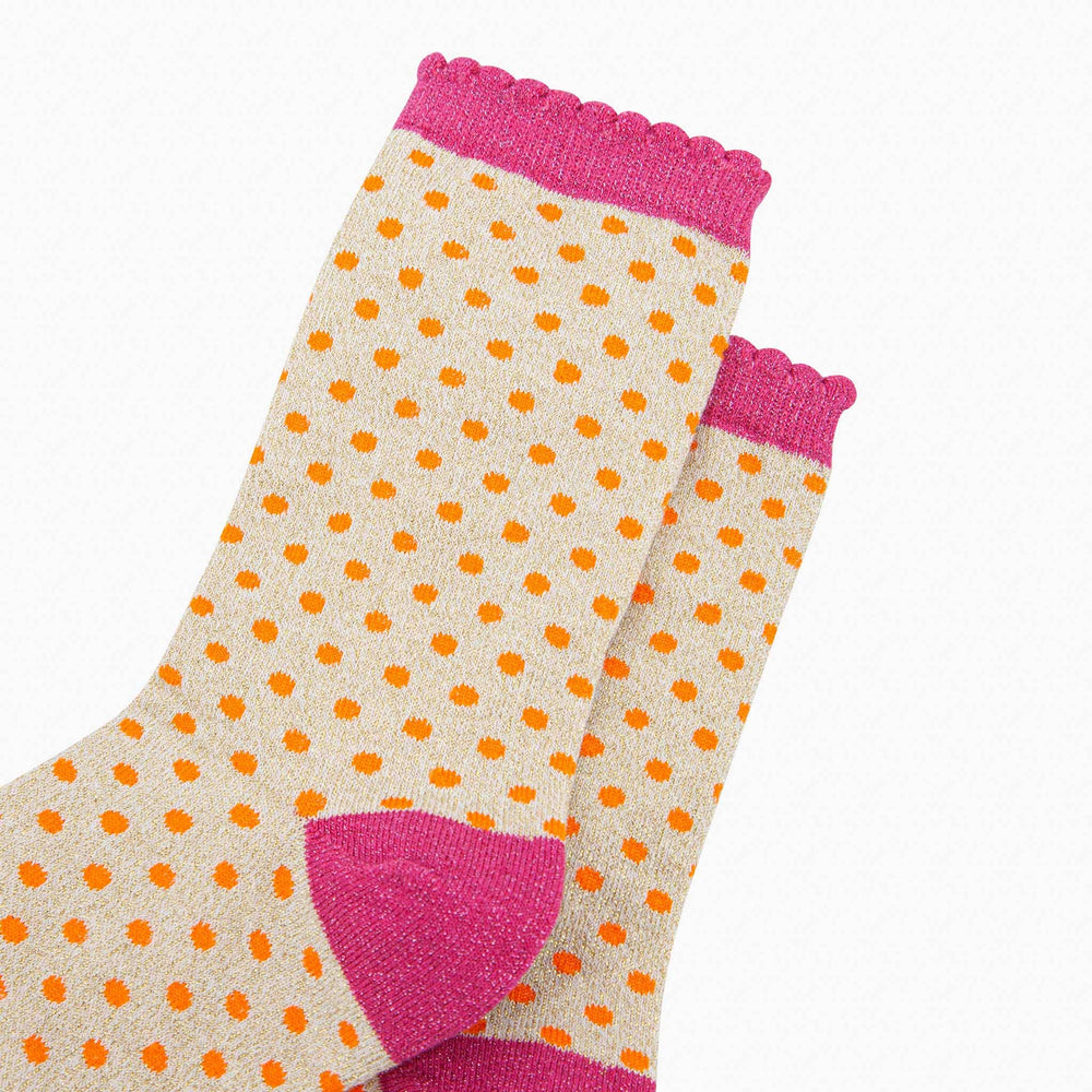 Cream glitter socks with orange polka dots, pink scallop cuff and heel accent