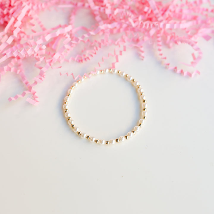 Beaded Blondes Luci Pearl Bracelet alternating white pearl and gold beads on elastic cord