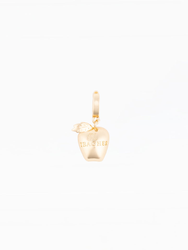 Michelle McDowell gold apple charm engraved with Number One Teacher on white background
