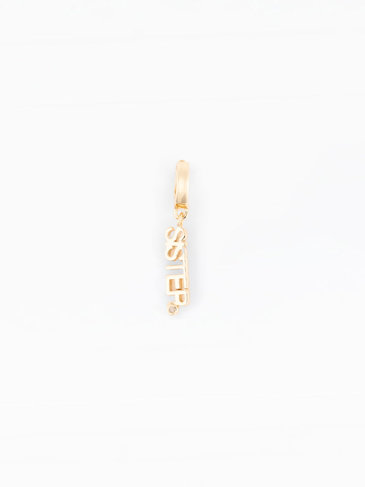 Michelle McDowell Sophie charm in gold with vertical SISTER text and diamond accent
