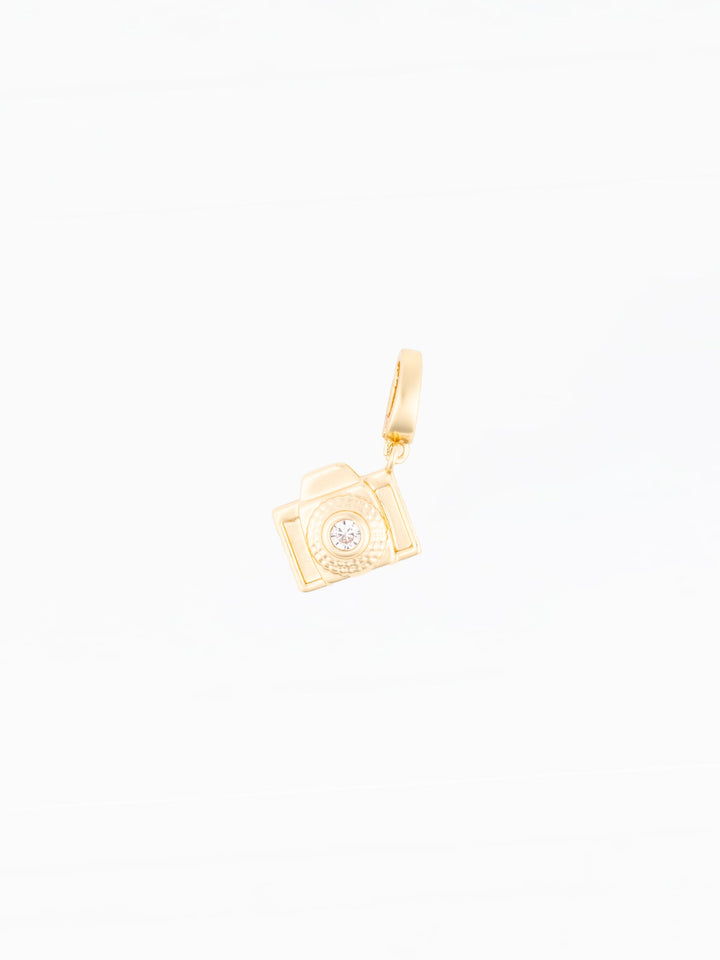 Michelle McDowell Sophie gold camera charm pendant with crystal lens detail