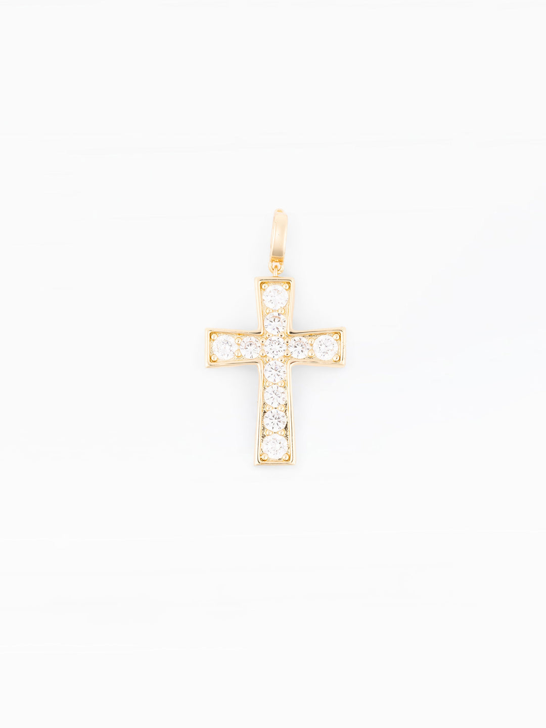 Gold cross charm pendant with sparkling clear cubic zirconia stones on white background