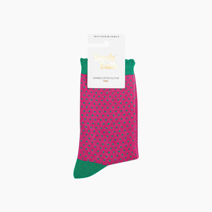 Hot pink glitter crew socks with green polka dots and green cuffs and toe