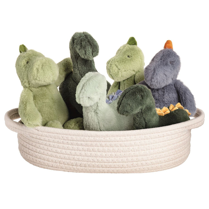 Collection of mini dinosaur plush toys in green and gray colors arranged in woven basket