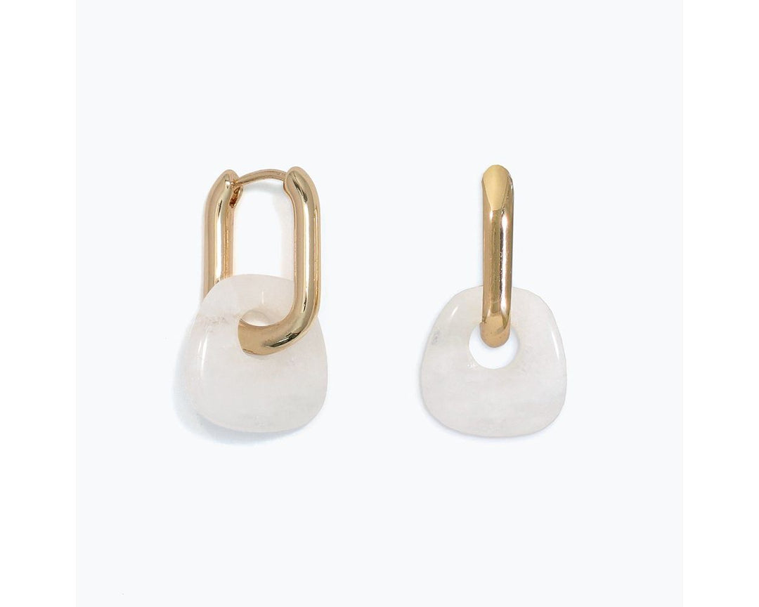 Gold rectangular huggie hoop earrings with white quartz donut charm dangles