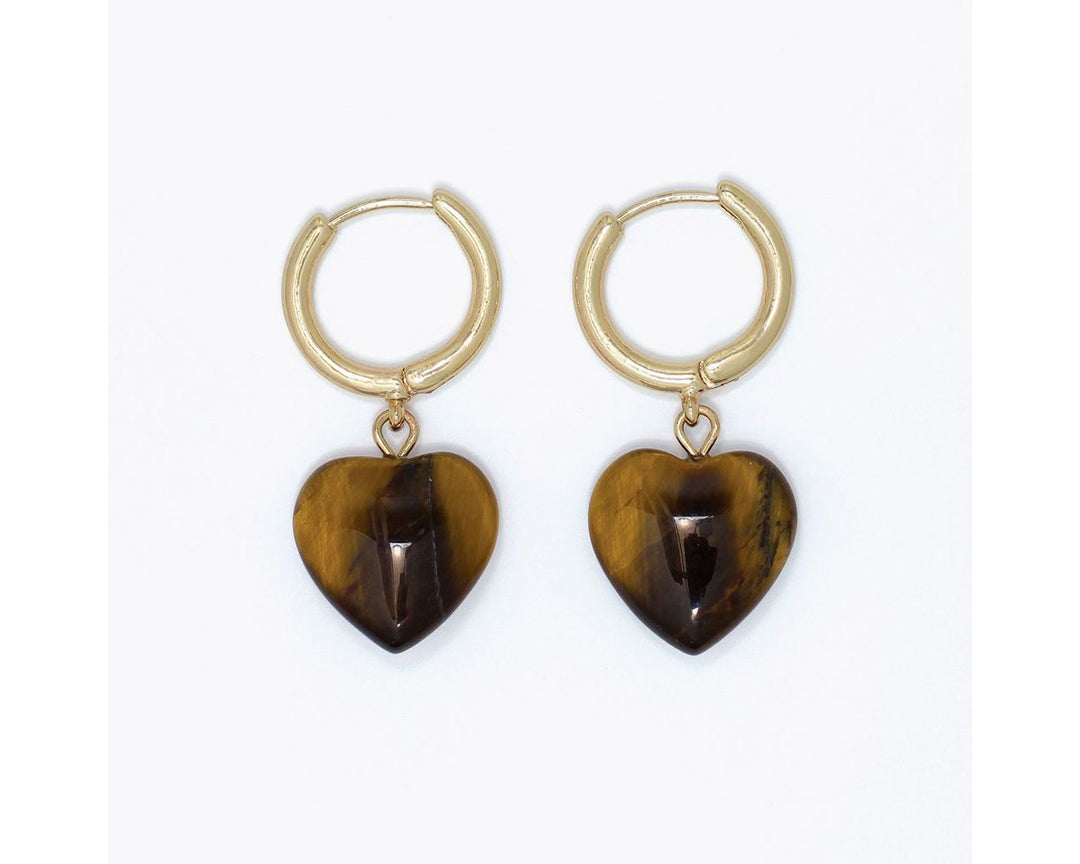 Gold huggie hoop earrings with polished tiger eye heart-shaped stone charms