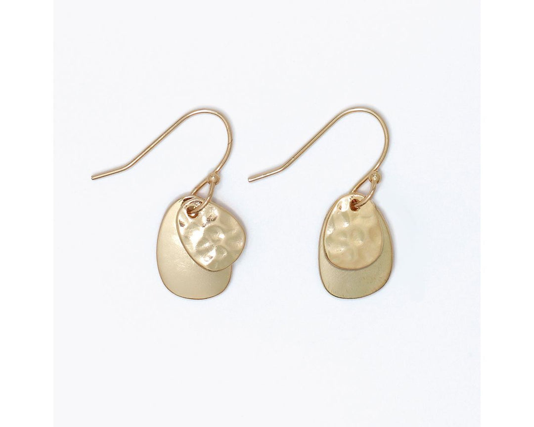 Gold layered drop earrings with hammered and polished oval disc charms on fish hooks