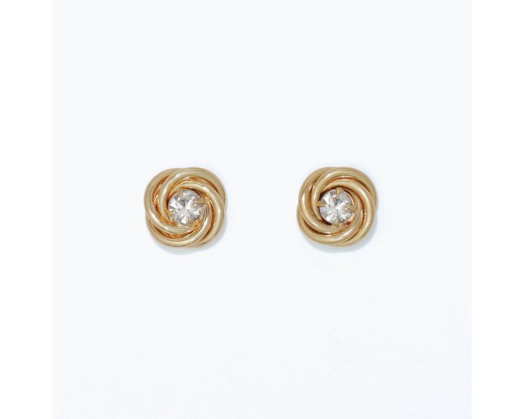 Gold twisted knot stud earrings with clear crystal centers on white background
