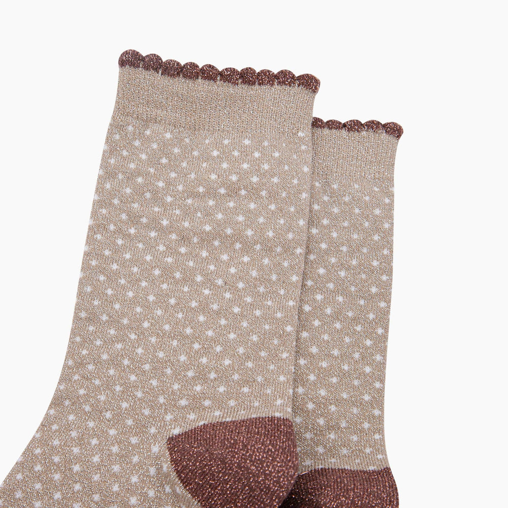 Beige glitter ankle socks with white polka dots, scalloped brown cuff, and heel detail