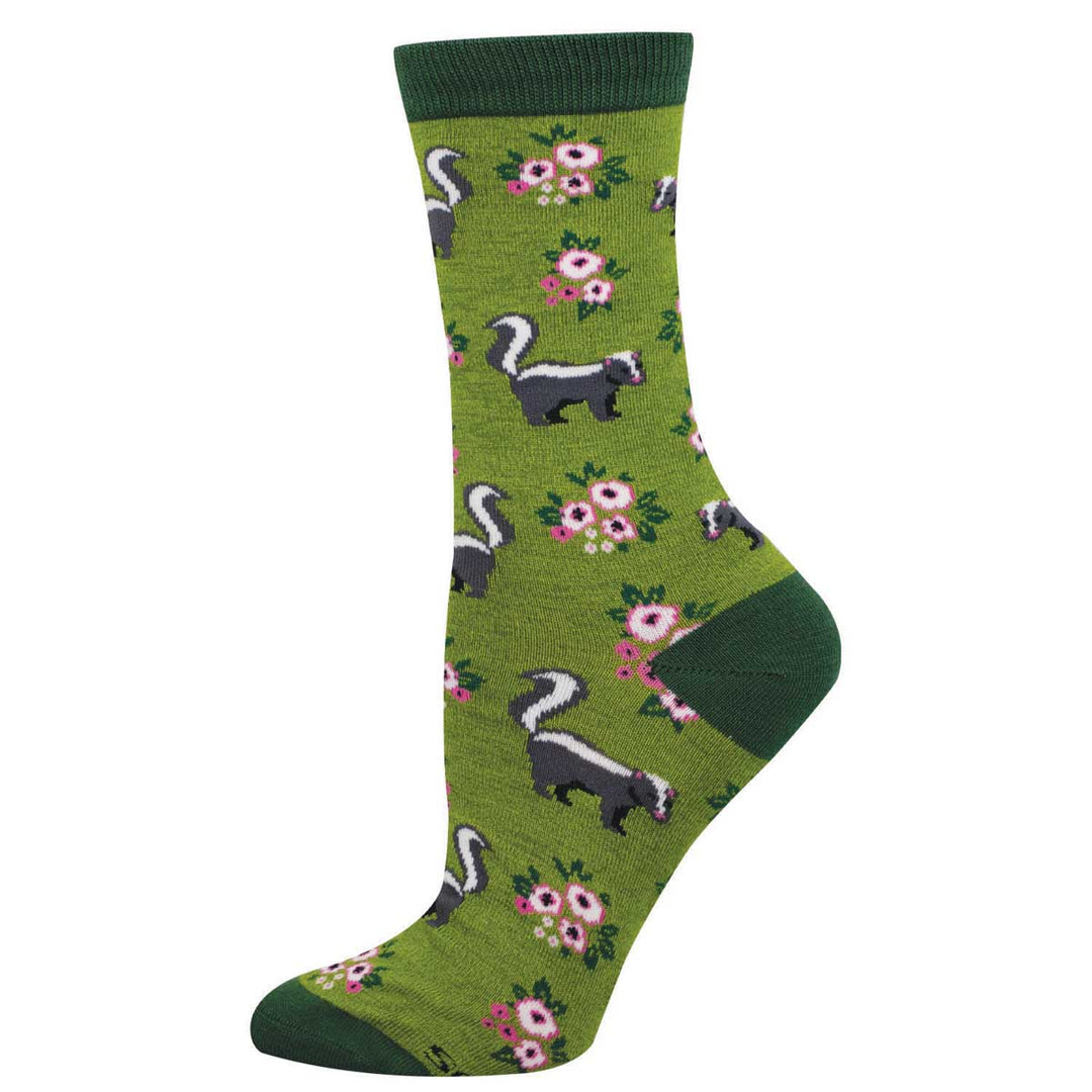 Green heather crew socks with skunk and pink floral pattern on olive green background