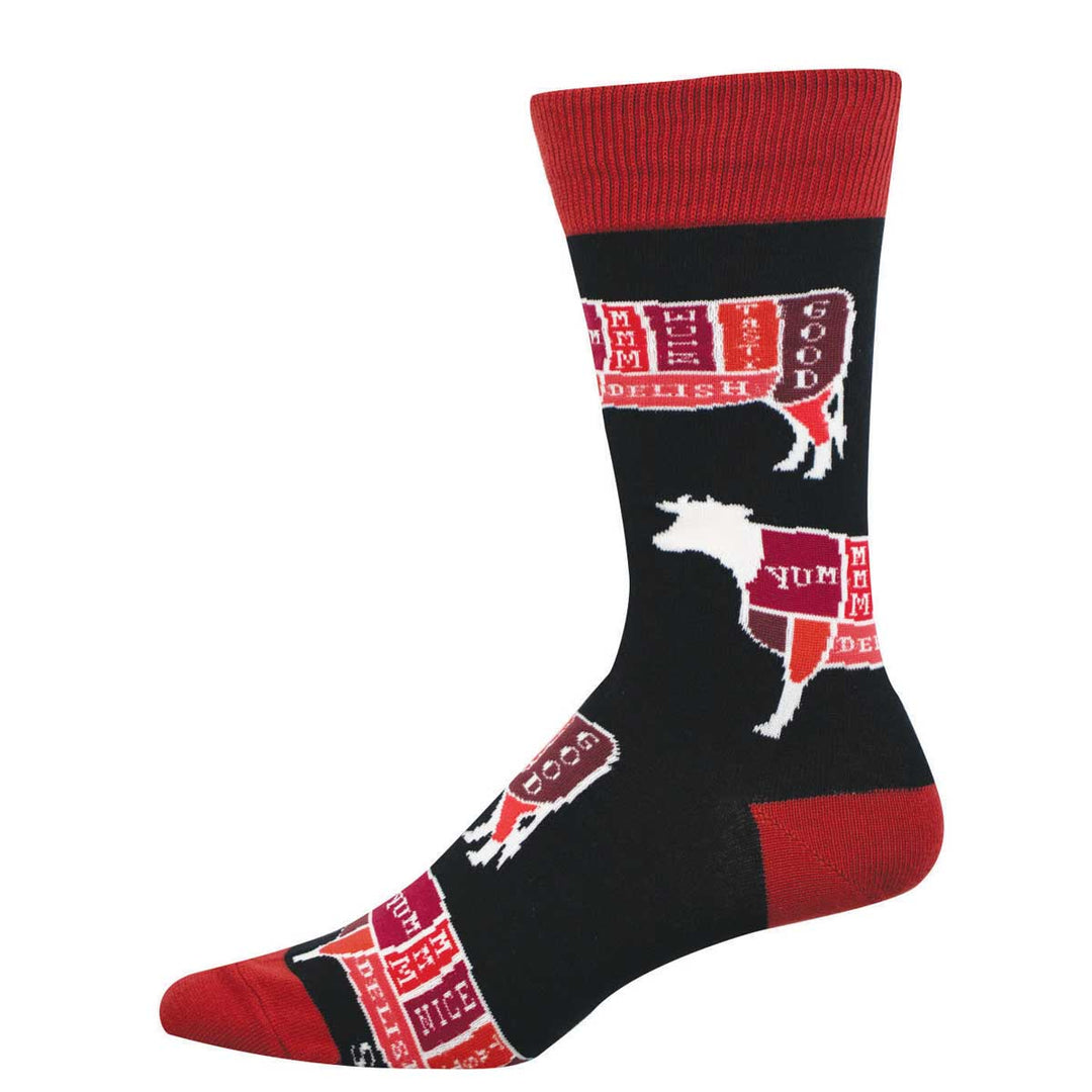 Socksmith Cattle Cuts crew socks in black with red accents and butcher diagram cow pattern
