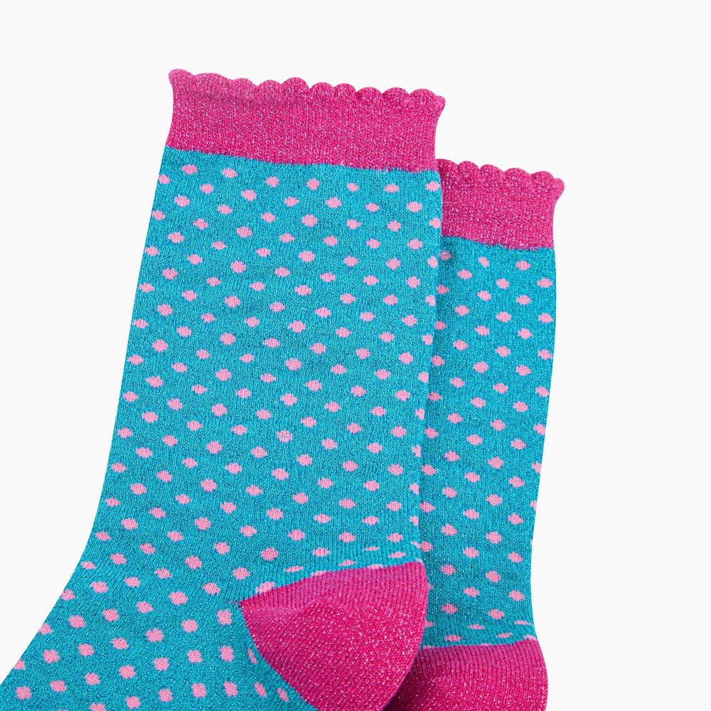 Turquoise polka dot crew socks with pink glitter scallop cuff and heel detail