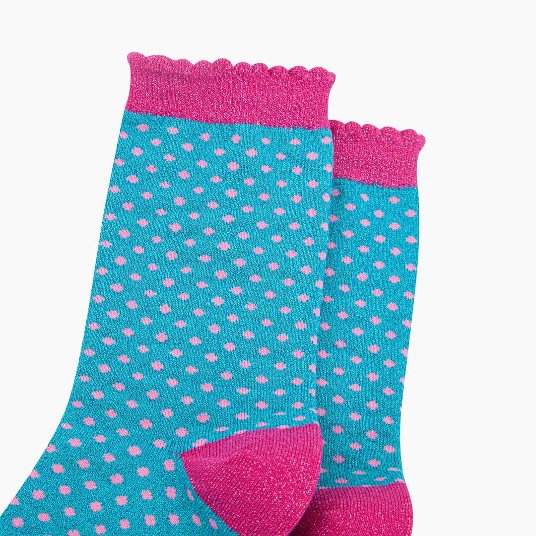 Turquoise polka dot crew socks with pink glitter scallop cuff and heel detail