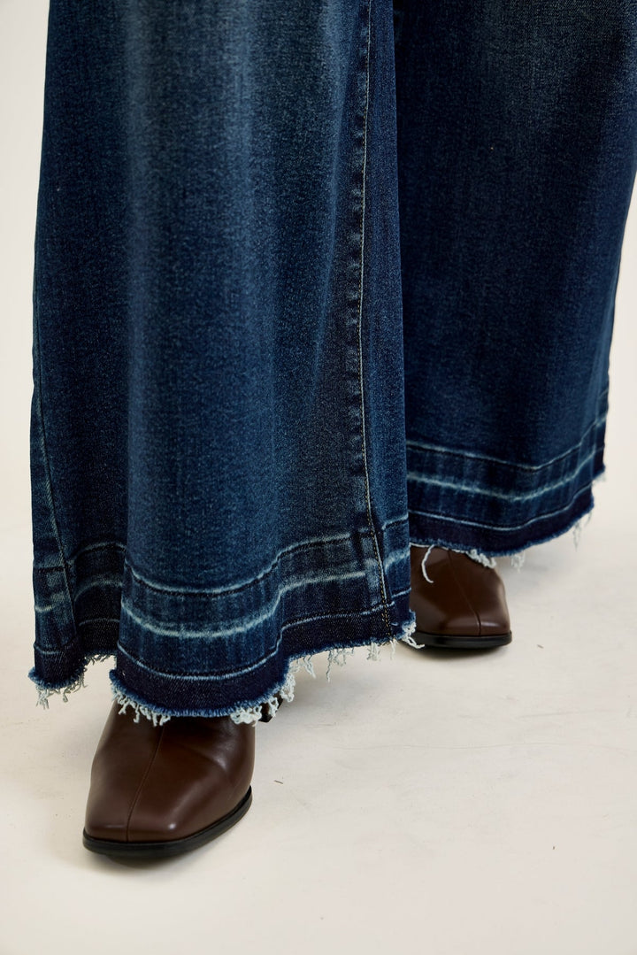 Judy Blue HW LIZA Palazzo jeans in medium wash with frayed hem and brown leather boots