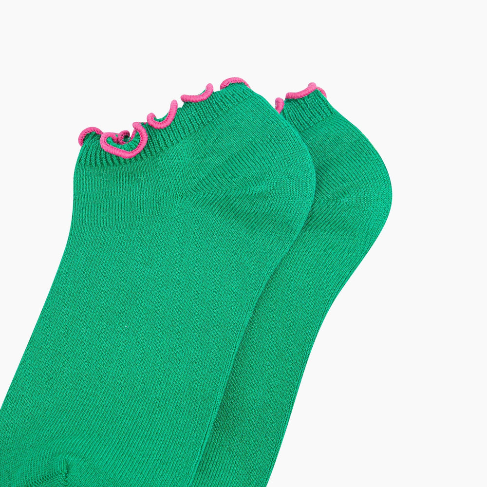 Green bamboo trainer socks with pink frilly scalloped trim, shown as a pair.