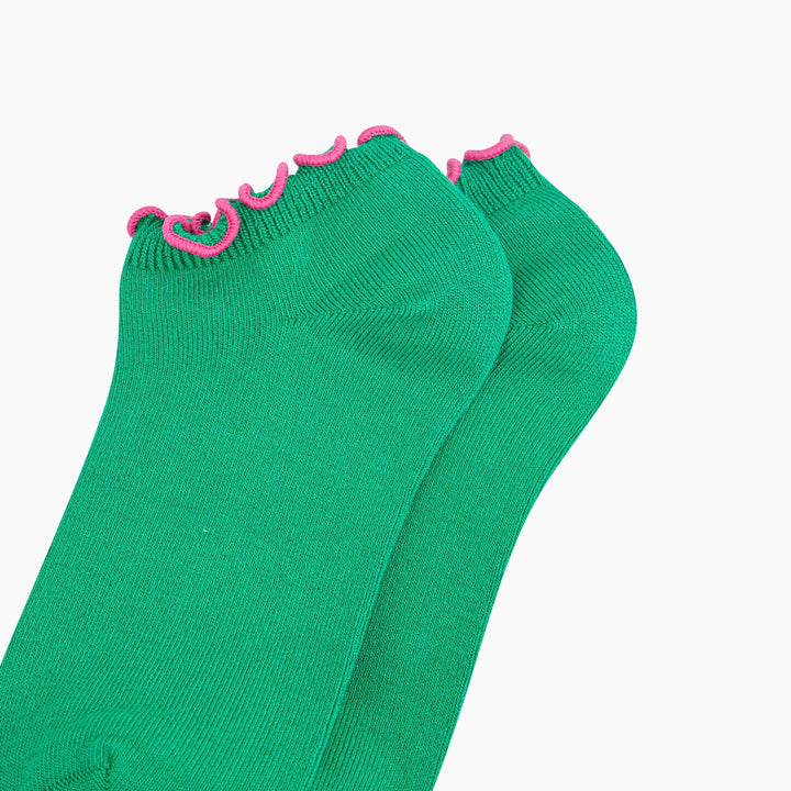 Green bamboo trainer socks with pink frilly scalloped trim, shown as a pair.