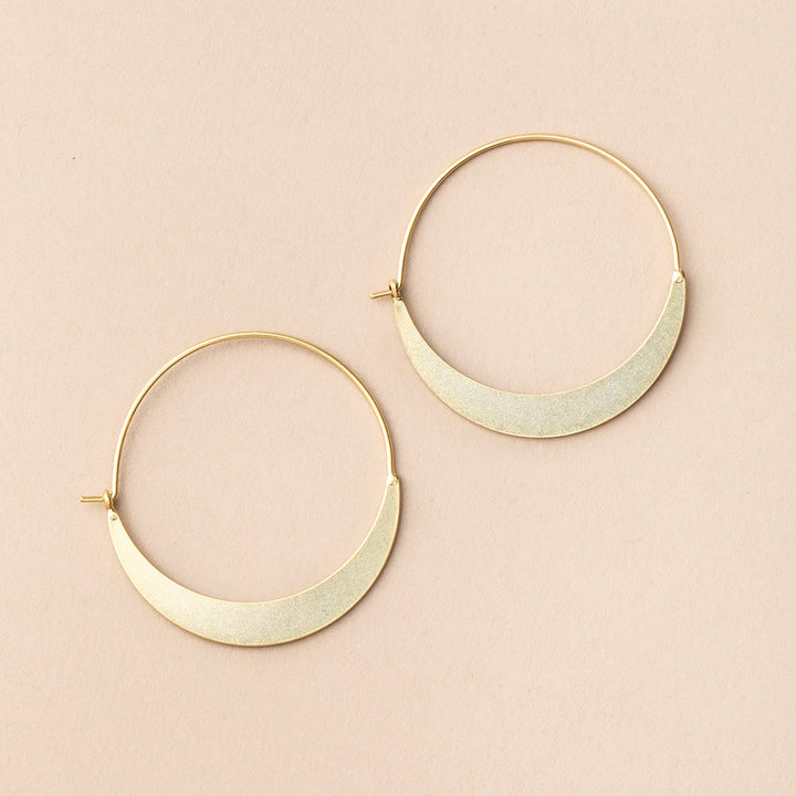Scout Refined Earring Collection crescent hoop earrings in gold vermeil on pink background