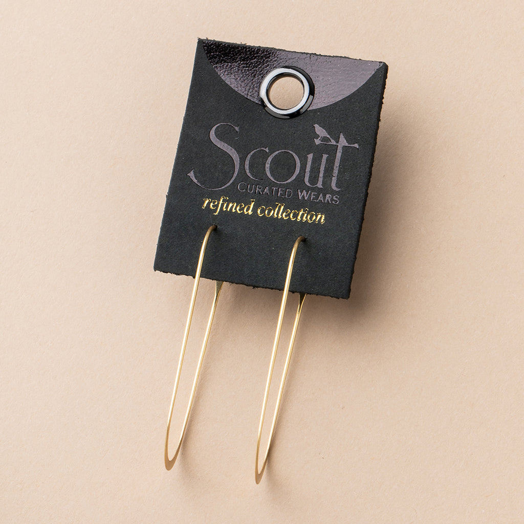 Scout Curated Wears Refined Collection gold oval hoop earrings on black leather display card