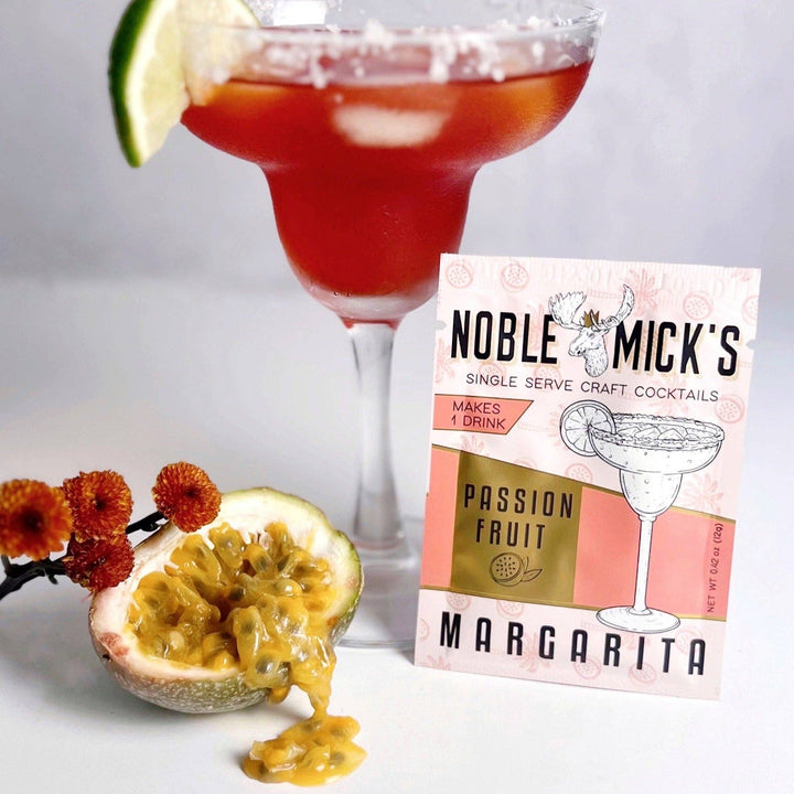 Noble Mick's Passion Fruit Margarita single serve craft cocktail mix packet with styled drink