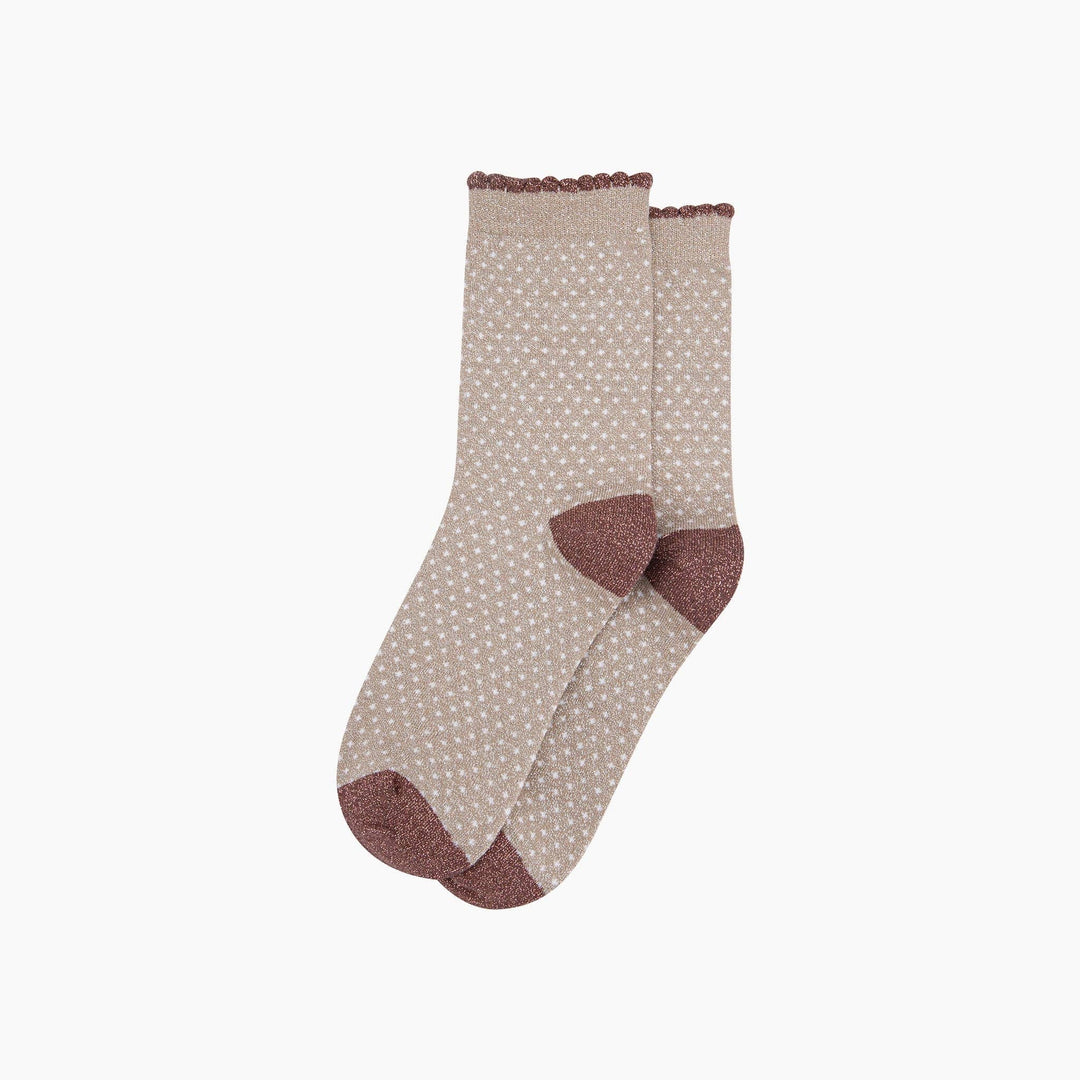 Beige glitter ankle socks with white polka dots and mauve scalloped cuffs and heel toe