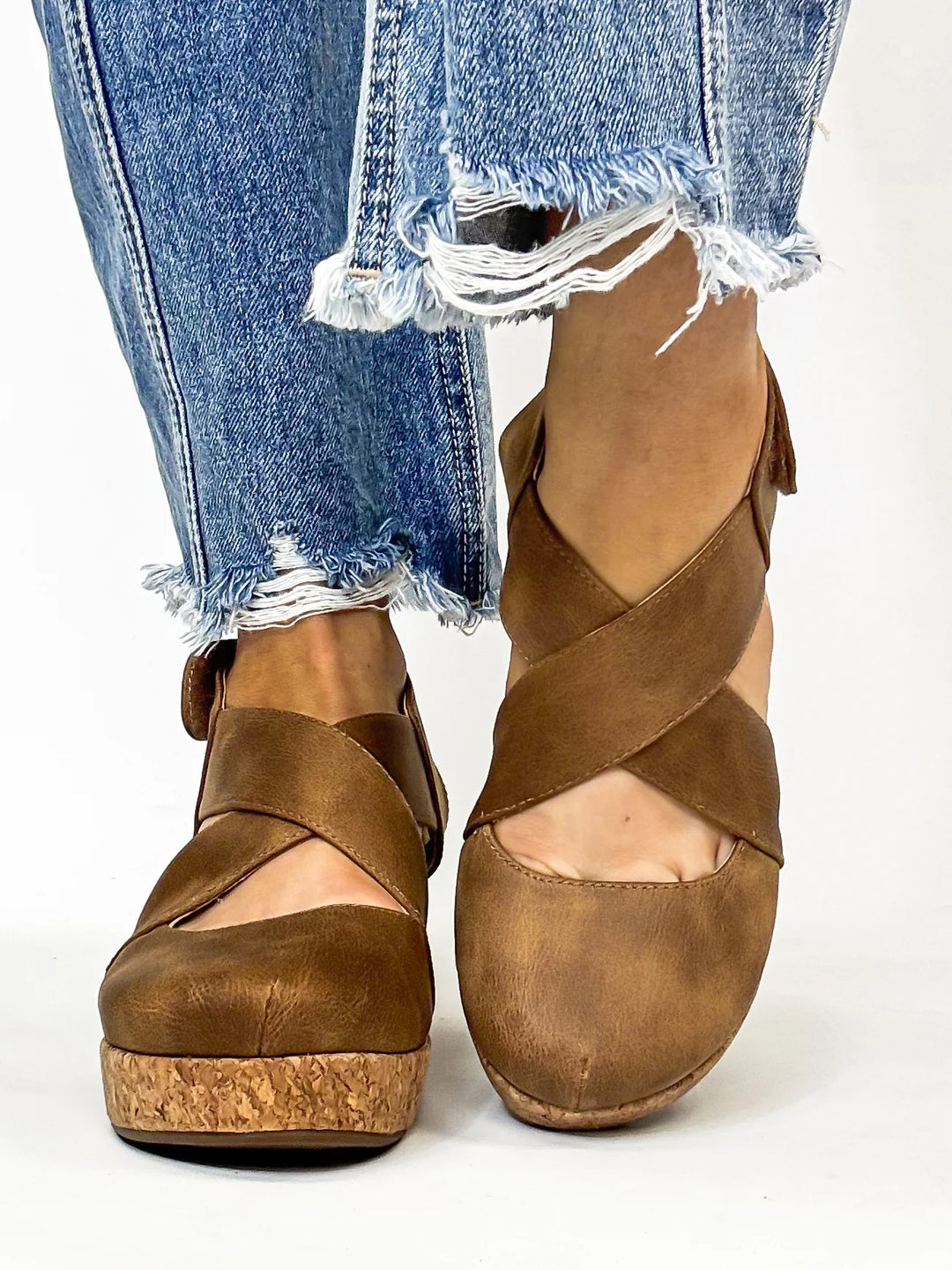 "Mustard suede crisscross cork wedges – closed toe, velcro slingback strap, cushioned insole, and lightweight 2.75” wedge with 1” platform; true-to-size fit with soft faux suede for cozy-chic style."

