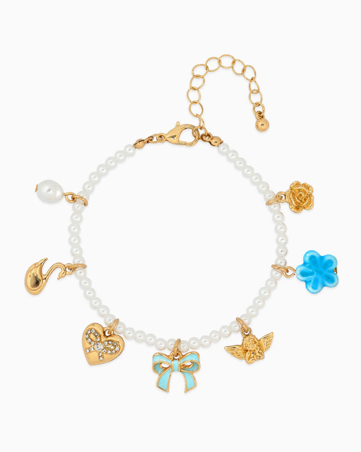Sessori Sugar Pearl Dreams charm bracelet with white pearls, gold charms, and blue bow pendant