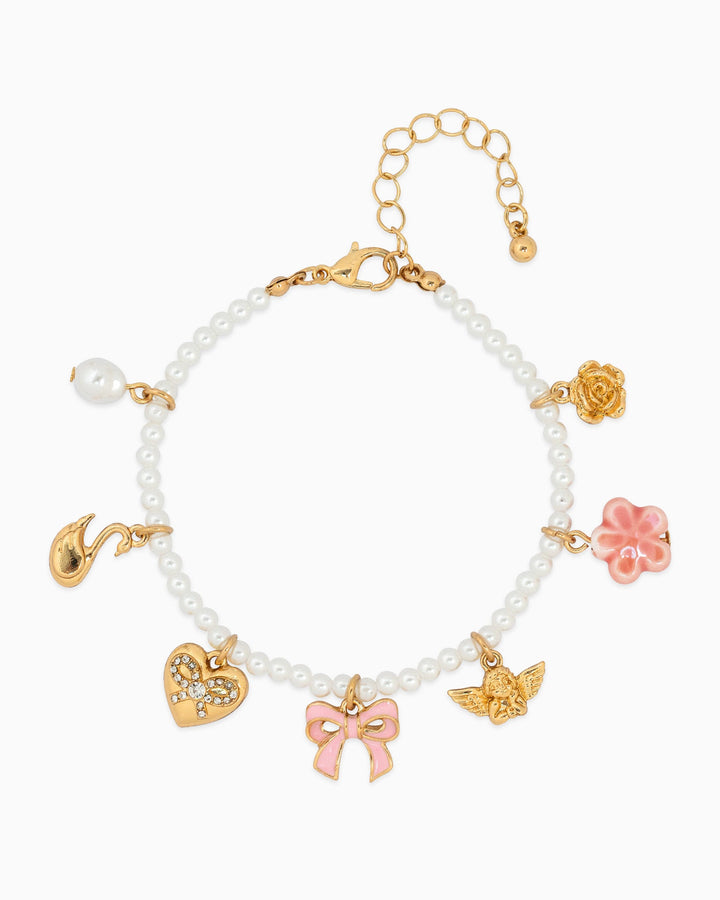Sessori Sugar Pearl Dreams charm bracelet with white pearls, gold charms, and pink bow pendant