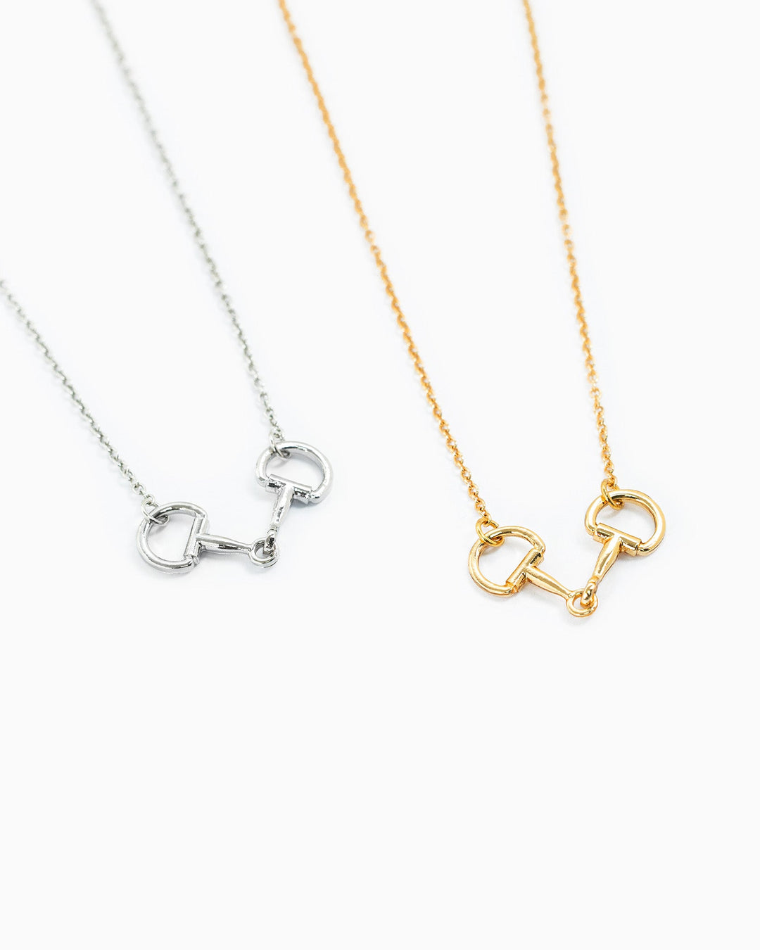 Sessori Western Double Linked Horsebit Necklace shown in silver and gold variants on delicate chains.
