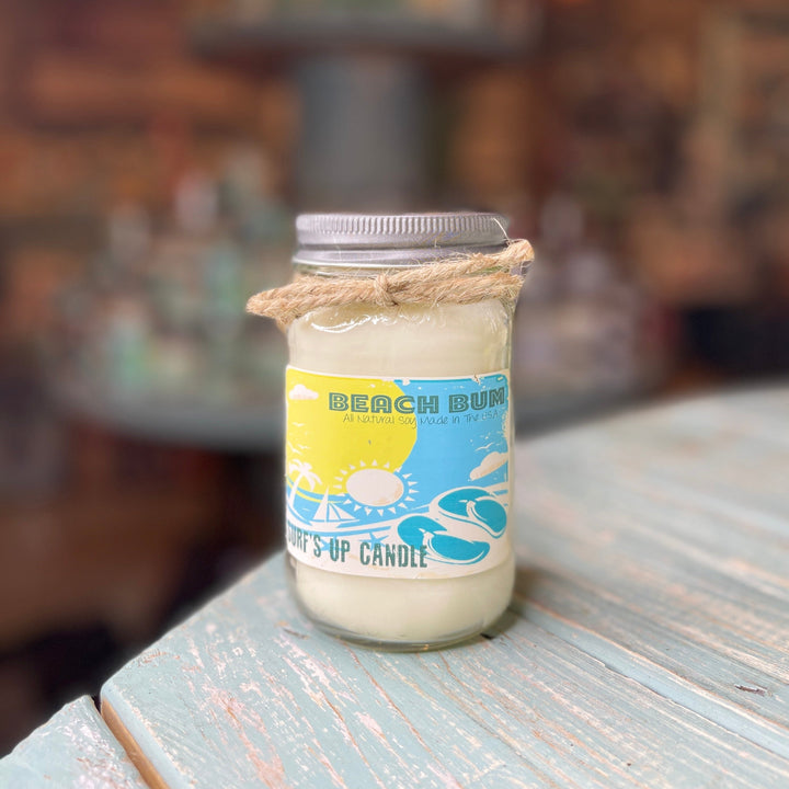 Beach Bum Surf's Up Candle in mason jar with yellow-blue label and twine bow