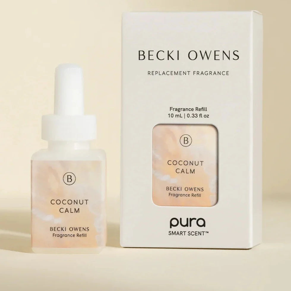 Pura Coconut Calm fragrance refill bottle with peach gradient design and packaging box