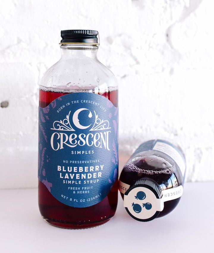 Crescent Simples Blueberry Lavender simple syrup bottle with dark purple liquid and decorative label