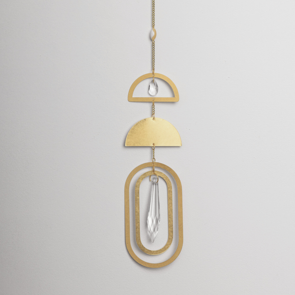 Scout suncatcher with gold geometric shapes and crystal elements hanging on cord