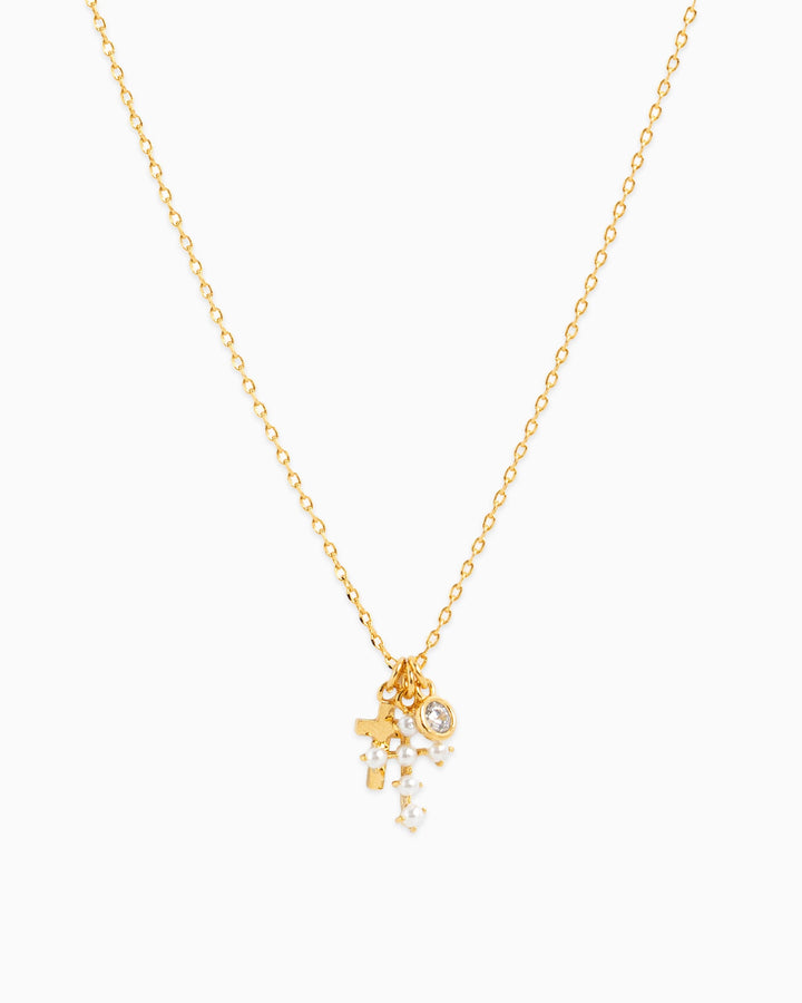Sessori gold chain necklace with pearl cross charm, crystal pendant, and star charm