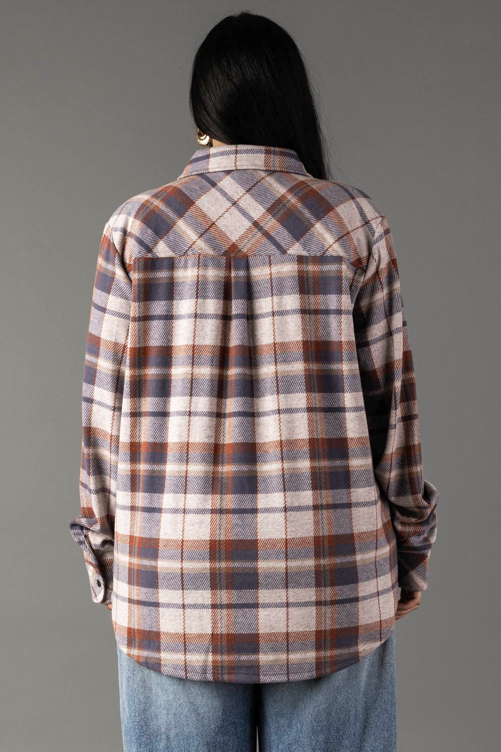 Back view of cream dusty blue and tan plaid flannel button-up shirt with long sleeves