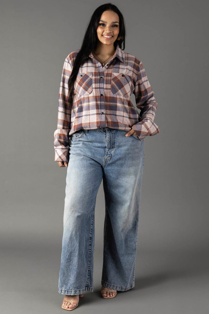 Cropped plaid flannel button-up shirt in cream, dusty blue, and tan plaid pattern
