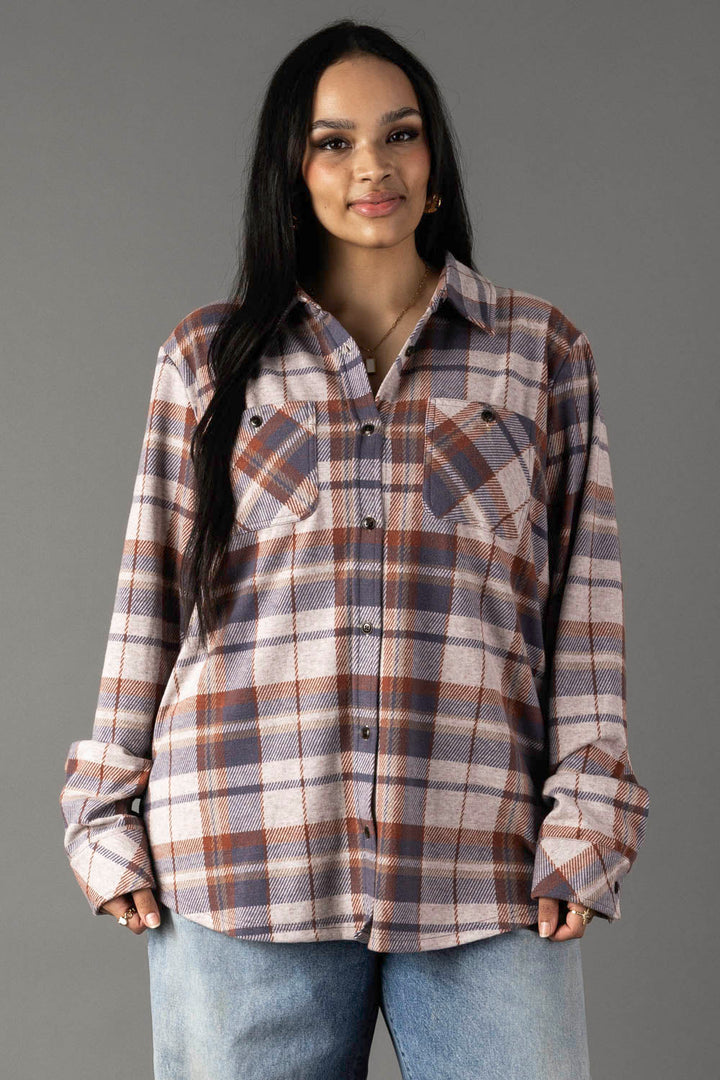 Women's cream dusty blue and tan plaid flannel button-up shirt with dual chest pockets