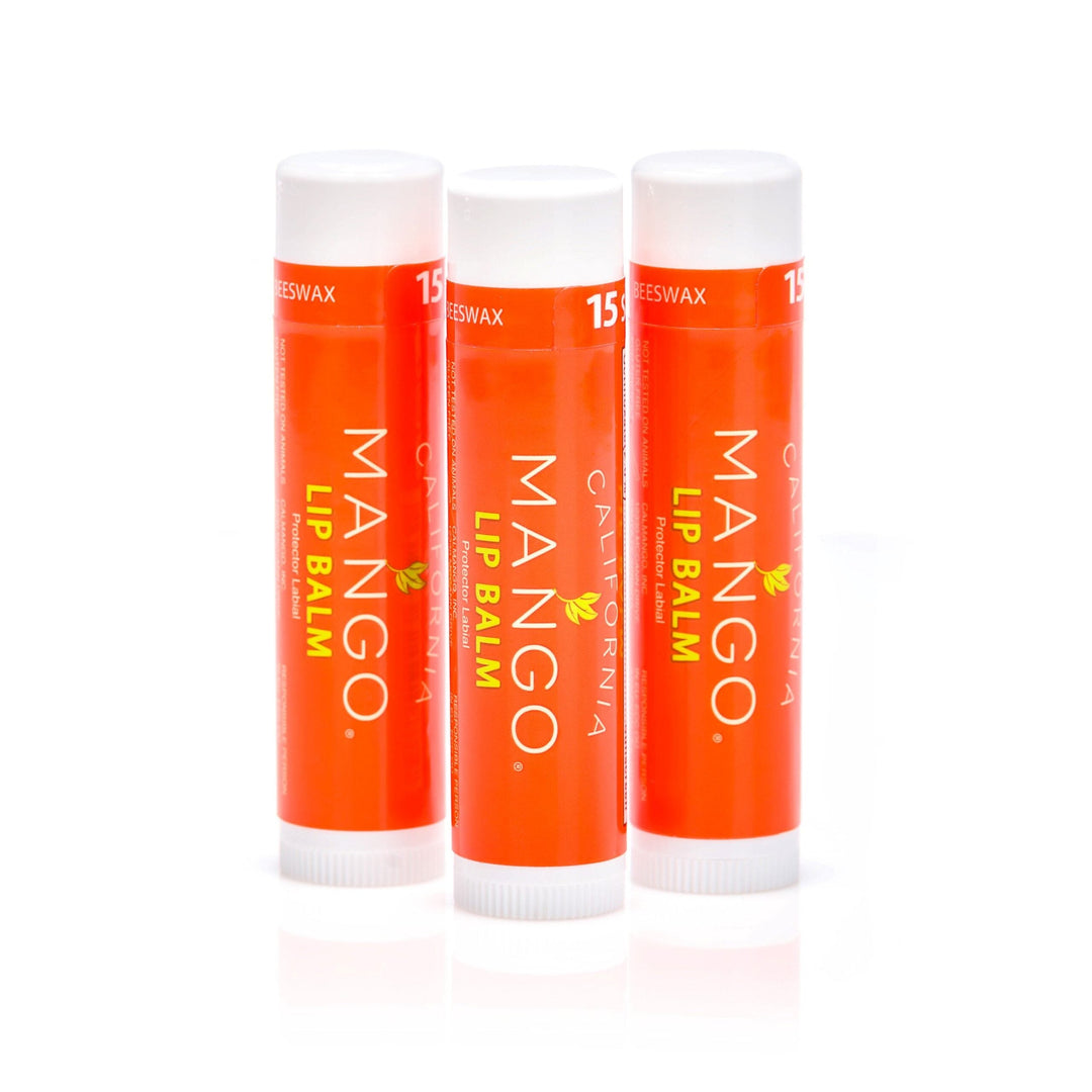 Three California Mango Lip Balm sticks in orange packaging with white caps, SPF 15.