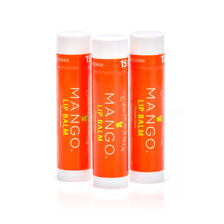 Three California Mango Lip Balm sticks in orange packaging with white caps, SPF 15.