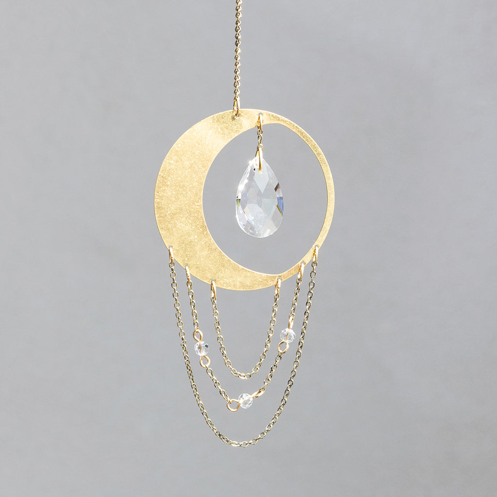 Scout Mini Suncatcher featuring gold crescent moon with hanging crystal and chain details