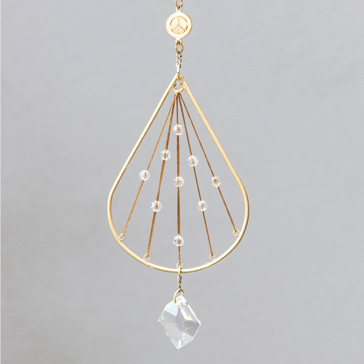 Scout Mini Suncatcher in gold with peace sign charm and crystal prism pendant