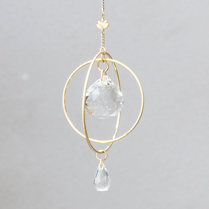Scout Mini Suncatcher in Lotus with gold geometric frame and clear crystal prisms