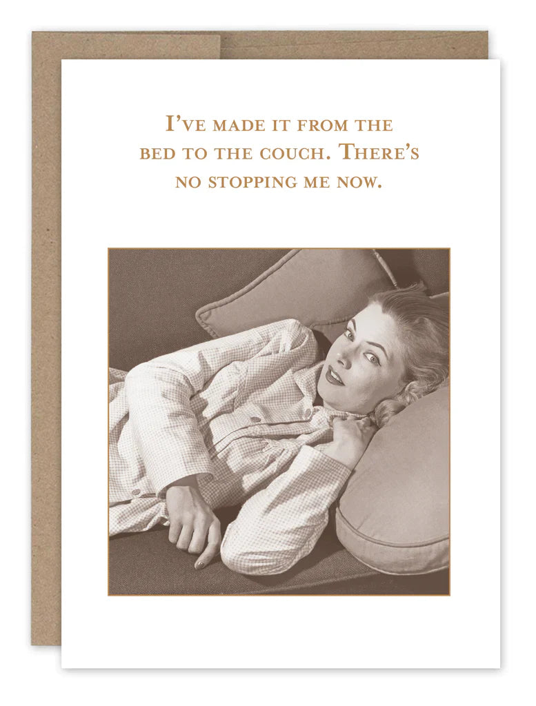 Humorous greeting card featuring woman on couch with text about bed to couch journey