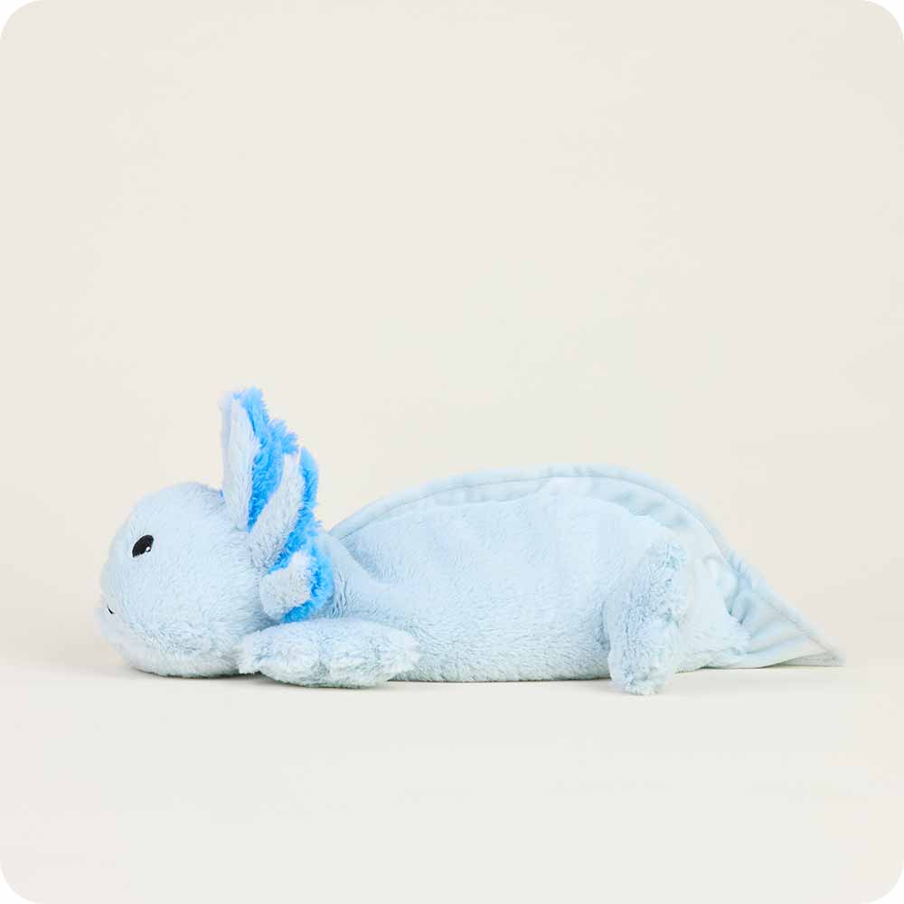 Warmies light blue axolotl plush toy lying on white background