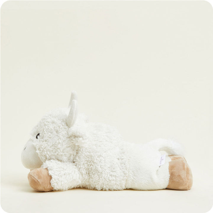 White fluffy unicorn Warmies stuffed animal with tan hooves on clean background