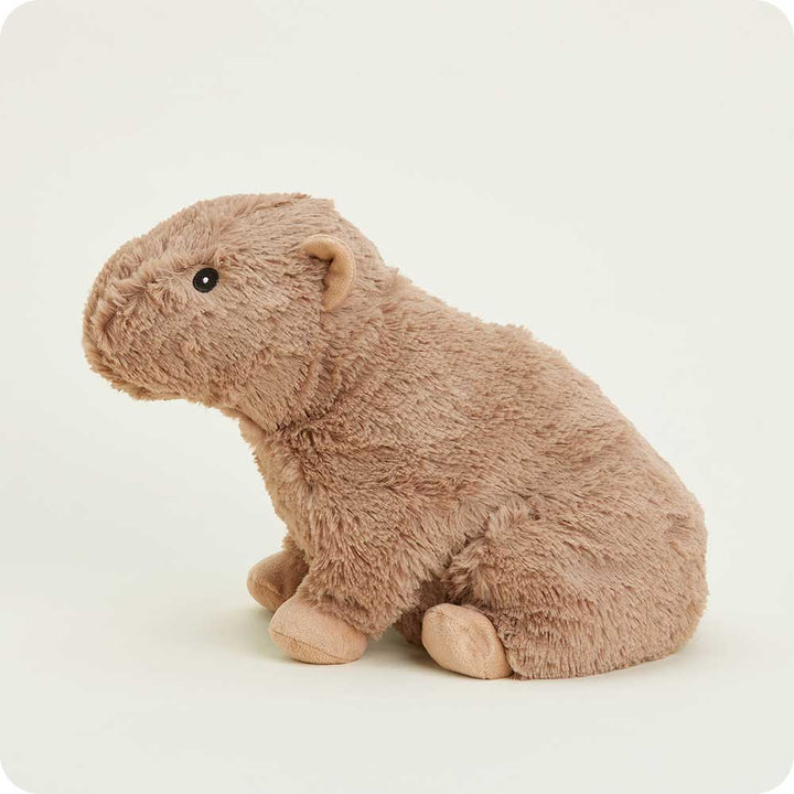 Brown plush Warmies capybara stuffed animal sitting against white background