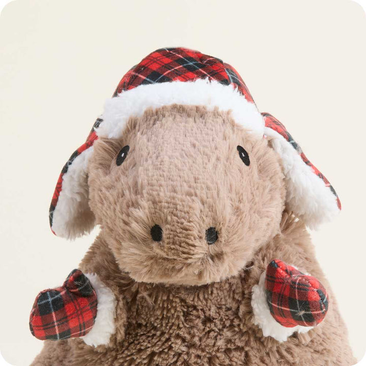 Warmies Cozy Capybara plush toy wearing festive red plaid winter hat and mittens